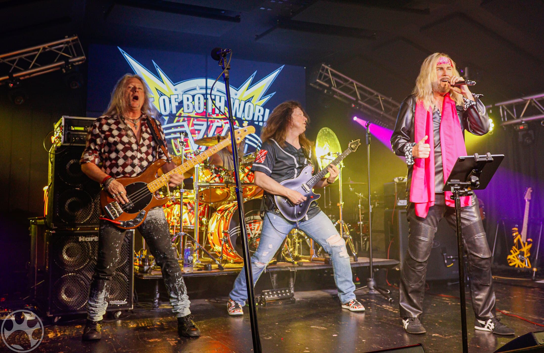 Best of Both Worlds performing a full-band Van Halen tribute set under concert lighting.